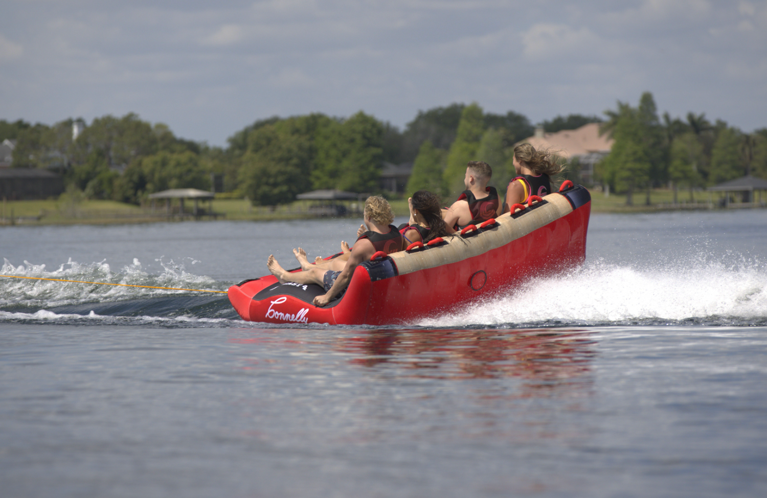 Rear view of Big Easy 4, showing the elevated seating and cushioned backrest as riders hold on.