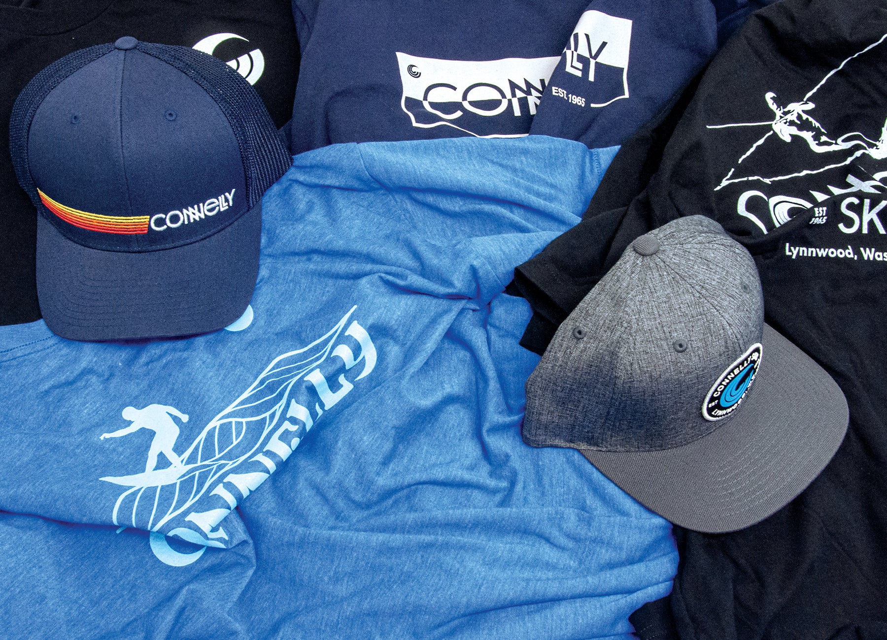 Selection of Connelly-branded apparel and accessories, including stylish hats and t-shirts for watersports enthusiasts.