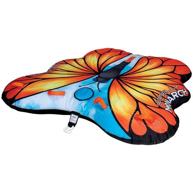 Angled side view of the Monarch towable tube, shaped like a butterfly with orange wings, black details, and blue sky accents.