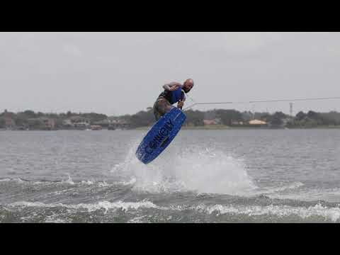 Thumbnail for the 2022 Reverb video, with a wakeboarder mid-air performing a trick over water with a Connelly Reverb board.